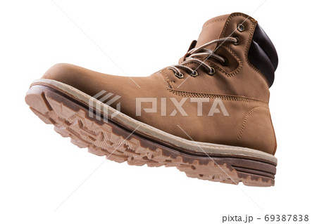 brown high boot made of nubuck leather, concept, on a white background, as if hanging in the air, bottom view, winter shoes for an active lifestyle brown high boot made of nubuck leather, concept, on a white background, as if hanging in the air, bottom view, winter shoes for an active lifestyle 69387838