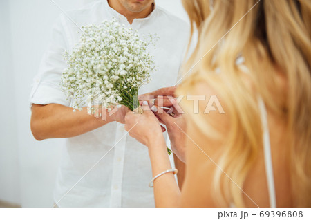 Hands of the bride and groom. Bride and groom holding hands at a wedding ceremony. 69396808