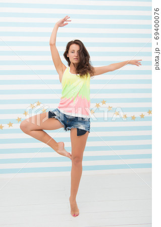 Woman fit slim lady posing as ballerina. Healthy lifestyle keep Woman fit slim lady posing as ballerina. Healthy lifestyle keep 69400076