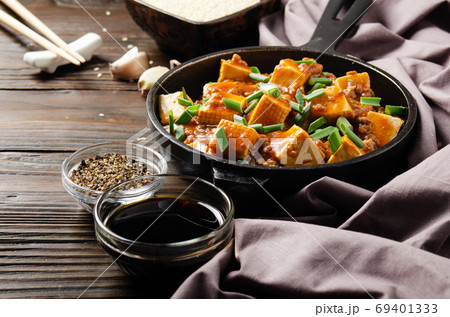 Mapo tofu in cast iron skillet with pork chopped chives soy sauc 69401333