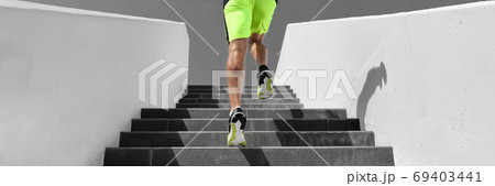Stairs workout runner man running up climbing stair outdoor gym cardio hiit interval run training panoramic banner background 69403441
