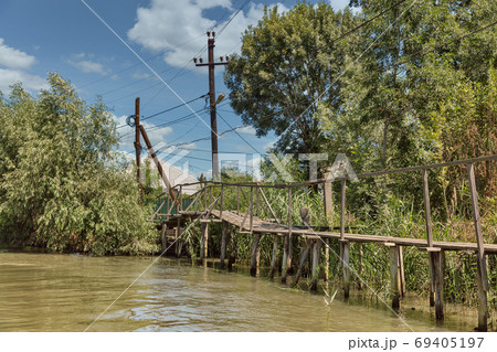 Traditional old wooden rural sidewalk in Vilkove, Ukraine. Traditional old wooden rural sidewalk in Vilkove, Ukraine. 69405197