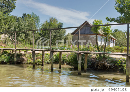Traditional old wooden rural sidewalk in Vilkove, Ukraine. Traditional old wooden rural sidewalk in Vilkove, Ukraine. 69405198