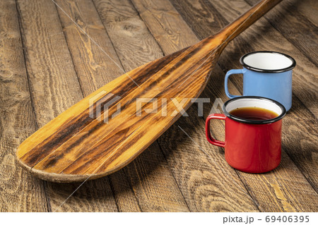 blade of old wooden canoe paddle with tea 69406395