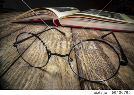 reading glasses and book - pinhole image 69406796