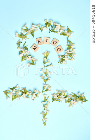 MeToo on wooden alphabet, surrounded by flowers depicting improvised women gender sign used for concept of sexual harrassment. MeToo on wooden alphabet, surrounded by flowers depicting improvised women gender sign used for concept of sexual harrassment. 69416618