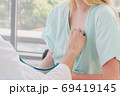 A doctor is examining the heartbeat of the patient 69419145
