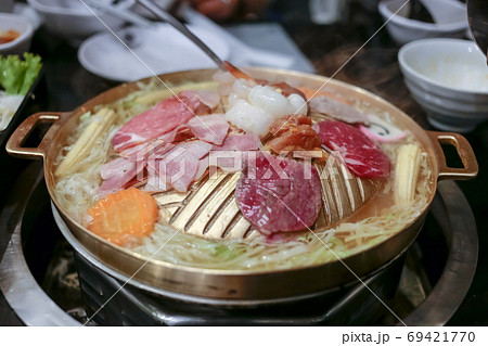 Pork, Shredded carrot, Shredded cabbage grill on BBQ brass pan, focus selective. 69421770