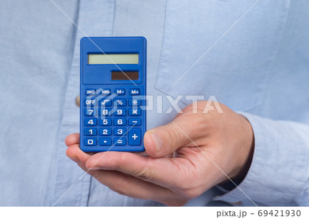 Calculator the hand of man. Close up. Precise calculations. tax calculation investment Calculator the hand of man. Close up. Precise calculations. tax calculation investment 69421930