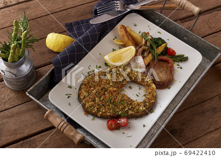 Salmon steak with vegetables on table rustic wooden Salmon steak with vegetables on table rustic wooden 69422410