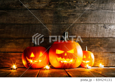 Halloween pumpkins and candles Halloween pumpkins and candles 69424131