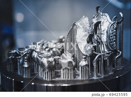 Object printed on metal 3d printer close-up. Object printed on metal 3d printer close-up. 69425595