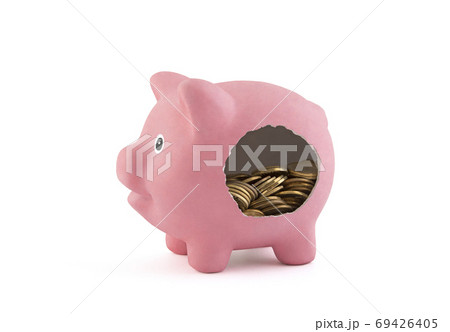 Leaky piggy bank with coins isolated on white background with clipping path 69426405