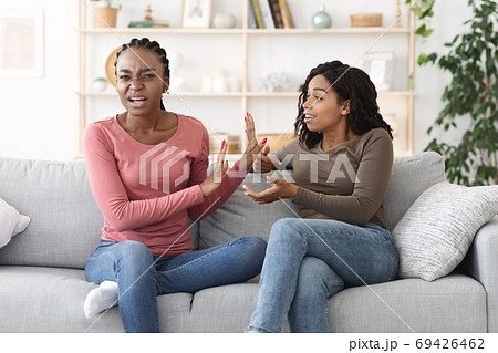 Two african american girls fighting at home 69426462