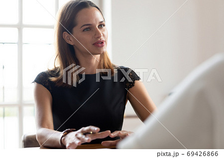 Confident Caucasian woman talk negotiating at meeting in office 69426866