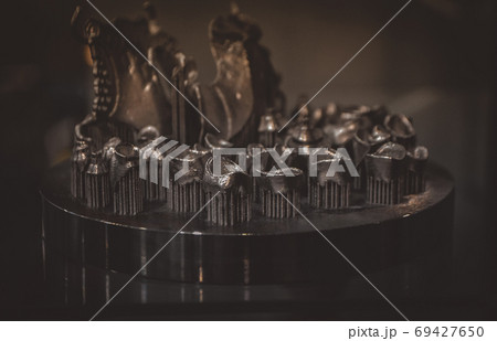 Object printed on metal 3d printer close-up. Object printed on metal 3d printer close-up. 69427650