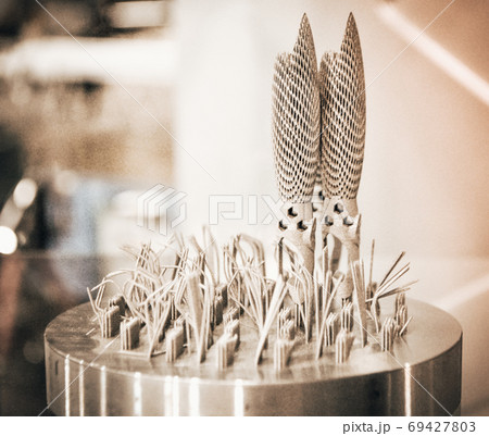 Object printed on metal 3d printer close-up. Object printed on metal 3d printer close-up. 69427803