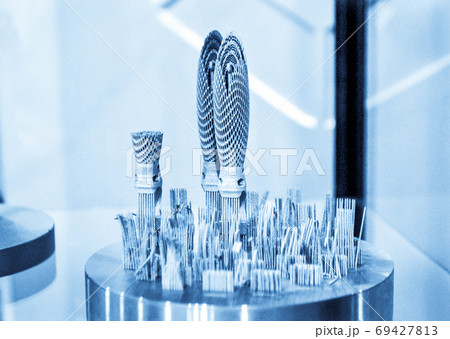 Object printed on metal 3d printer close-up Object printed on metal 3d printer close-up 69427813