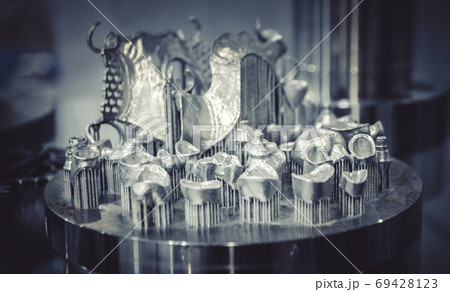 Object printed on metal 3d printer close-up Object printed on metal 3d printer close-up 69428123
