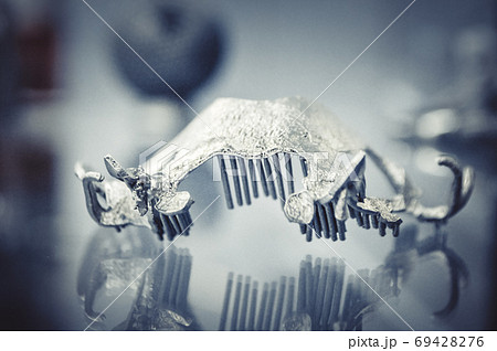 Object printed on metal 3d printer close-up. Object printed on metal 3d printer close-up. 69428276