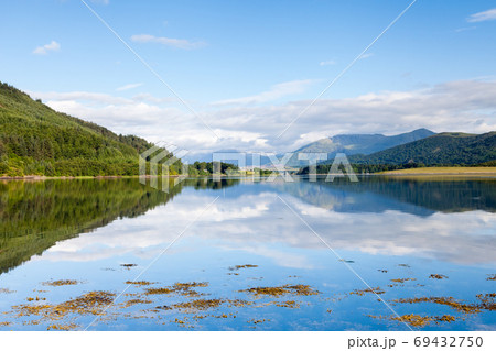 Loch Leven. The view across Loch Leven from Ballachulish towards Ballachulish Bridge in the Scottish highlands. Loch Leven is a sea loch on the west coast of Scotland. Loch Leven. The view across Loch Leven from Ballachulish towards Ballachulish Bridge in the Scottish highlands. Loch Leven is a sea loch on the west coast of Scotland. 69432750
