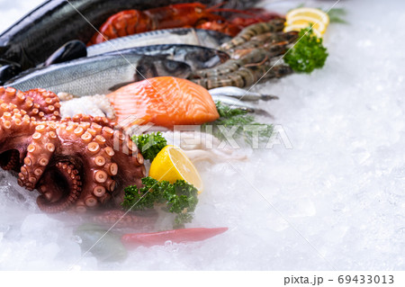 Fresh seafood on ice background. Fresh seafood on ice background. 69433013