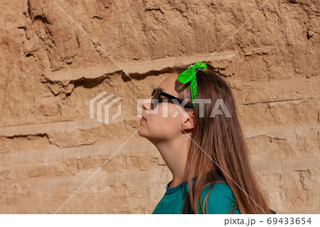 Portrait of pretty hipster girl in sunglasses Portrait of pretty hipster girl in sunglasses 69433654