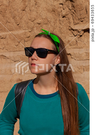 Portrait of pretty hipster girl in sunglasses Portrait of pretty hipster girl in sunglasses 69433655