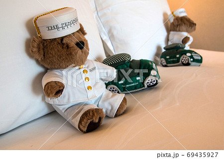 CHICAGO, ILLINOIS, UNITED STATES - DEC 12th, 2015: Teddy bear on comfort bed as a welcome present of luxury hotel 69435927