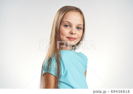cute girl blue dresses cropped view light background emotions childhood fun 69436818