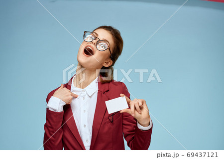 Business woman red jacket business card official glasses blue background Business woman red jacket business card official glasses blue background 69437121