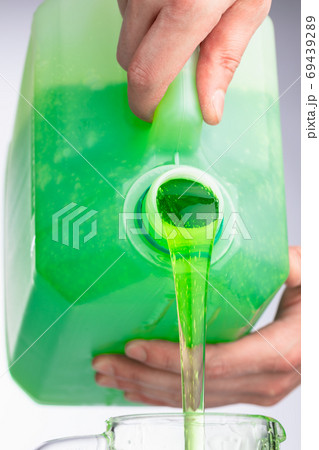liquid soap in plastic bottle, pouring by hands 69439289