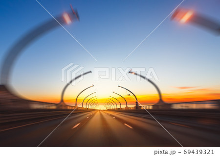 modern highway toll road with motion blur at sunset 69439321
