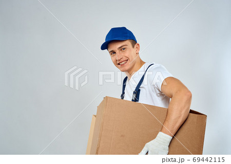 Man worker with box in hands delivery loading service packing service 69442115