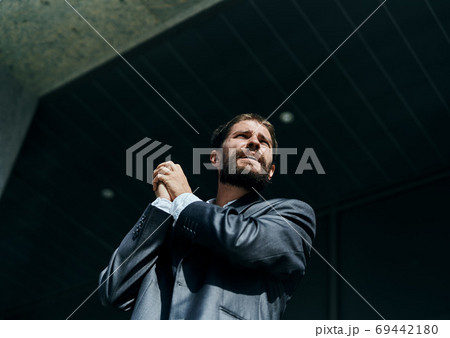 business man in a suit talking on the phone outdoors business manager executive 69442180