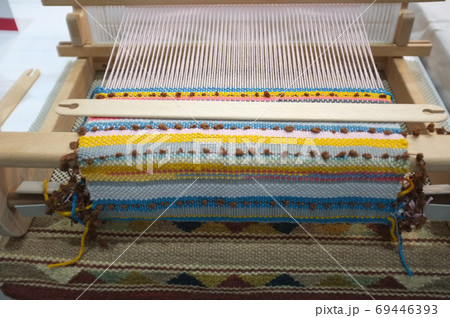 Weave silk cotton on the manual wood loom Weave silk cotton on the manual wood loom 69446393