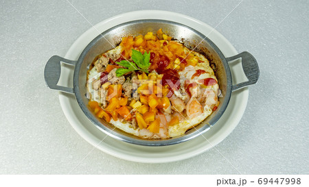 Pan-fried eggs on the pan white background 69447998