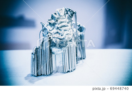 Dental crowns printed in laser sintering machine. Modern 3D printer 69448740