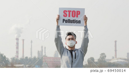 man hold stop pollution sign man hold stop pollution sign 69450014
