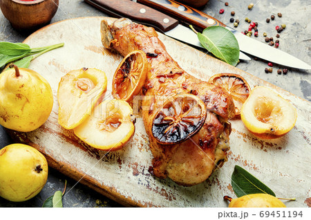 Roasted turkey legs with pear 69451194
