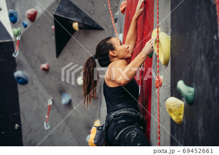 Extreme sport, stress relief, bouldering, people and healthy lifestyle concept. Extreme sport, stress relief, bouldering, people and healthy lifestyle concept. 69452661