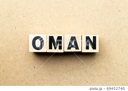 Letter block in word Oman on wood background 69452740