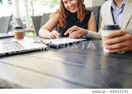Business people analyzing report 69453291