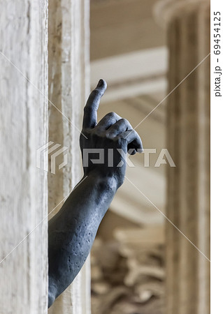 Statue with a pointing hand in Kazan Cathedral - St. Petersburg 69454125