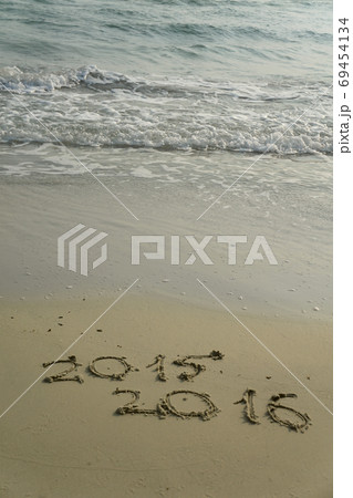 2015 and 2016 year on the sand beach 69454134