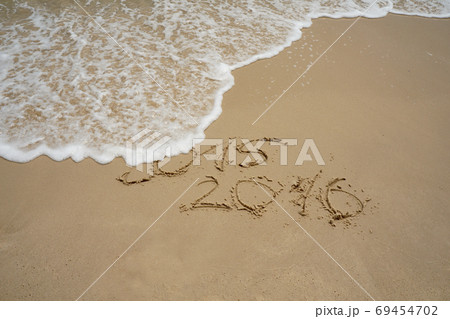 2015 and 2016 year on the sand beach 69454702