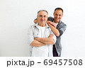 Senior Father With Adult Son on a white background 69457508