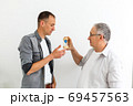 father and son with hourglass 69457563