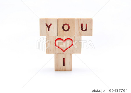 Wooden dice with a heart and the words I and YOU on a white background 69457764