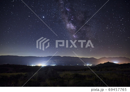 Starry night with the Milky Way over some mountains 69457765